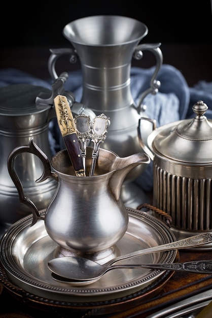 Silver dishes on old surface