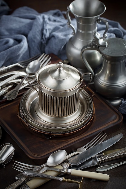 Silver dishes on old surface