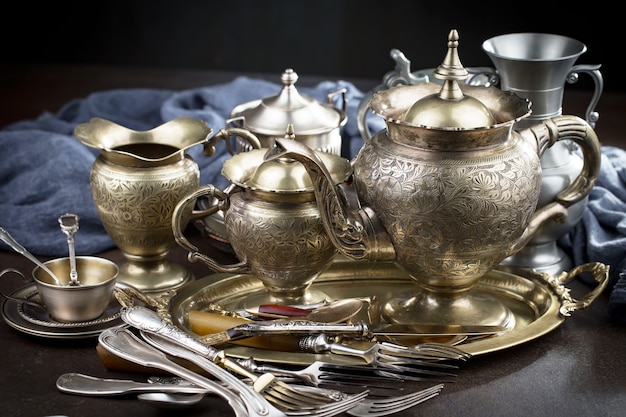 Premium Photo Silver Dishes On Old Surface premium-photo-silver-dishes-on-old-surface