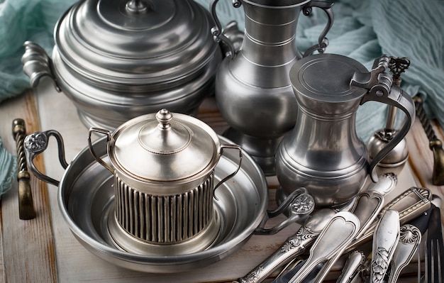 Silver dishes on old surface