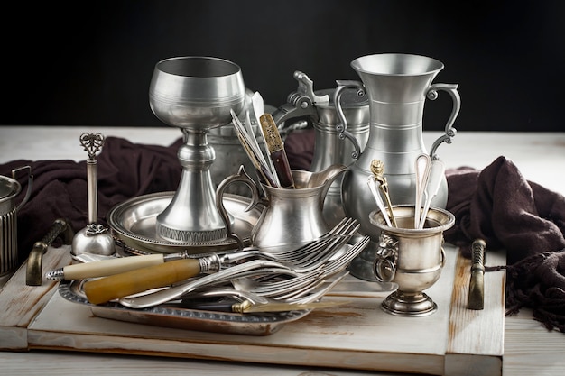 Premium Photo Silver Dishes On Old Surface premium-photo-silver-dishes-on-old-surface