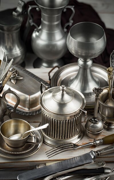 Silver dishes on old surface