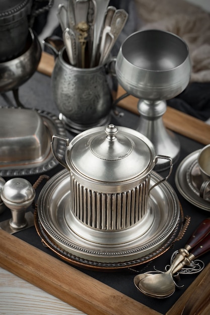 Silver dishes on old surface