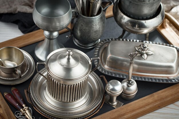 Silver dishes on old surface