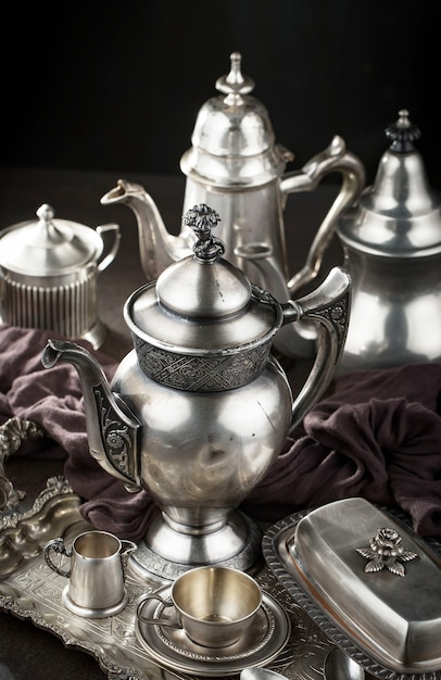 Silver dishes on old surface