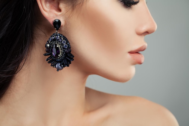 Silver earrings with gems Perfect woman closeup profile portrait