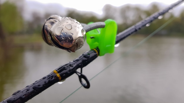 Silver fishing bells are worn on a fishing rod while fishing