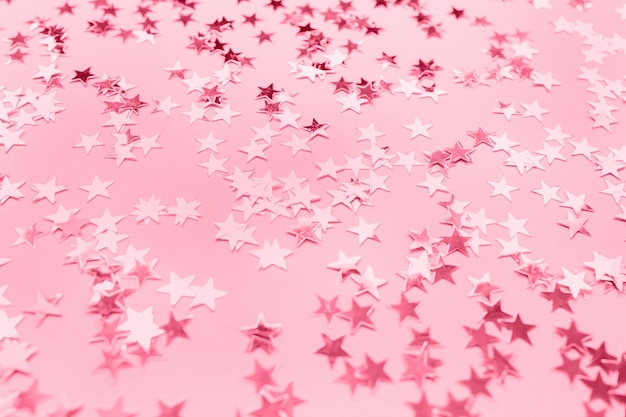 Silver foil confetti stars toned in trendy color of the year 2023 Viva Magenta