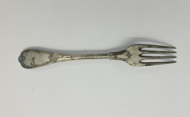 A silver fork with the number 3 on it