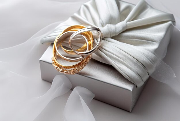 Silver and gold bracelets in gift box jewelry flatlay on neutral background