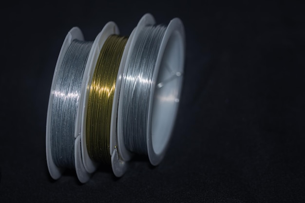 silver and gold wire in spools for arts and crafts