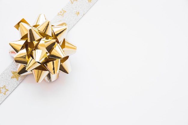 Silver golden ribbon bow decorated on white background