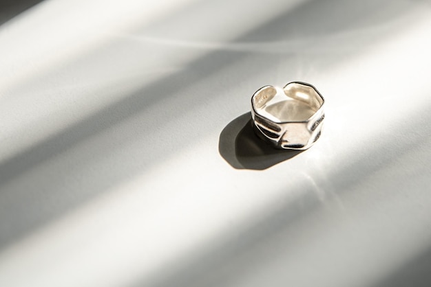 Silver jewelry ring in the sun