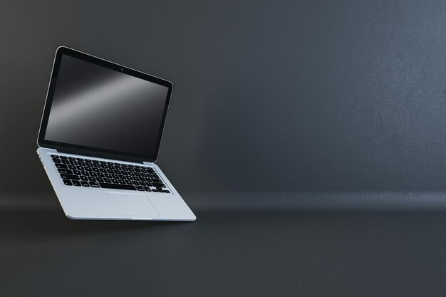 Silver laptop with glossy screen on dark studio background technology and design concept 3D Rendering