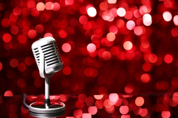 Silver microphone on red background