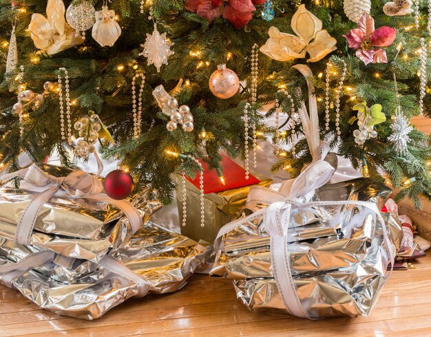 Silver presents under christmas tree