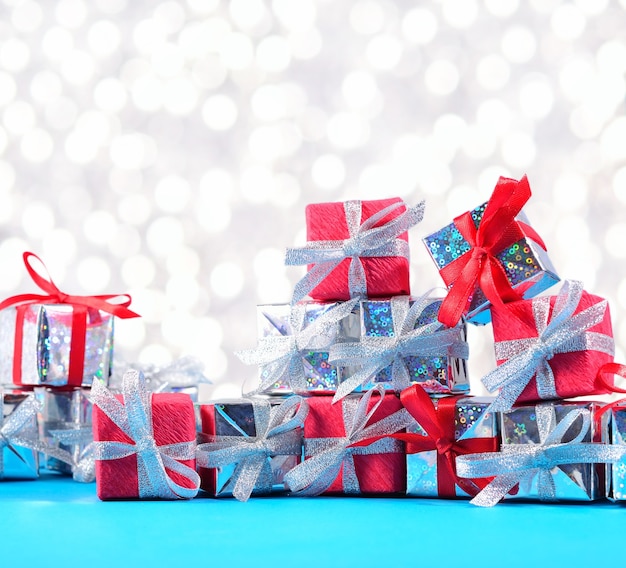 Silver and red gifts close-up on a bokeh background