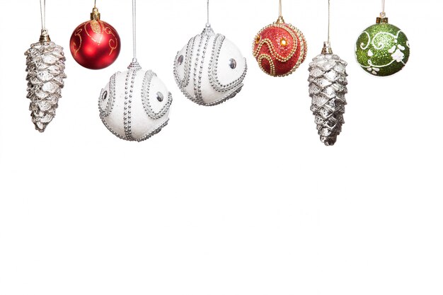 Photo silver, red, green christmas new year baubles for christmas tree isolated on white