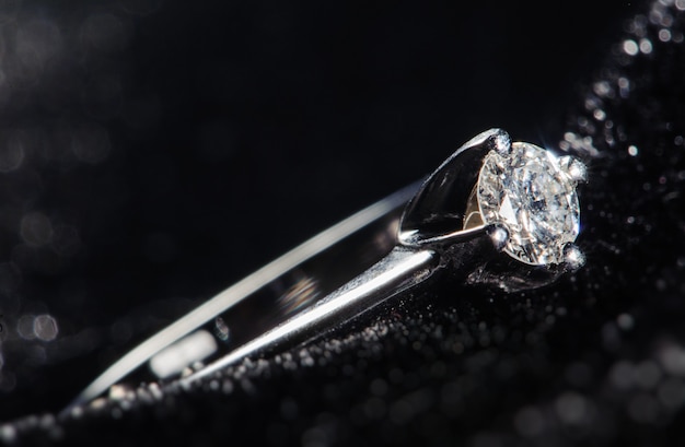 Silver ring on a black background