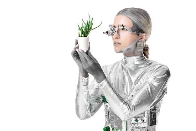 白い未来のテクノロジーで隔離された鉢の植物を見ている 眼の義肢を持つ銀色のロボット