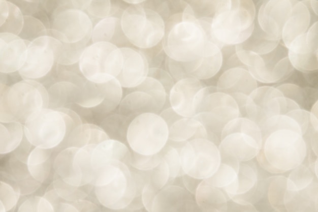 Silver Sparkling Lights Festive background with texture.