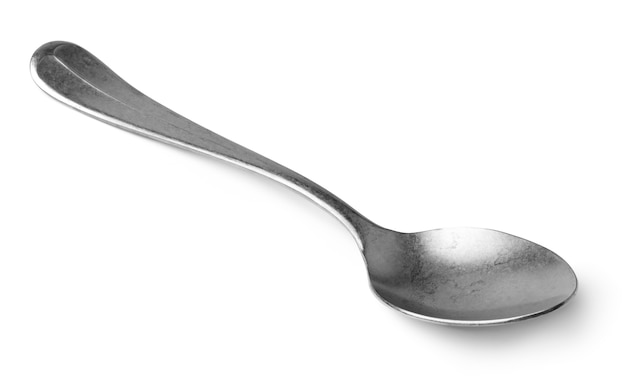 Silver spoon isolated on white wall close up, cutlery