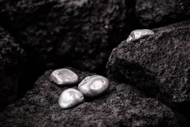 Silver stones in mine, mineral extraction concept