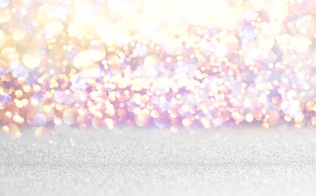 Photo silver and white glitter vintage lights background. defocused