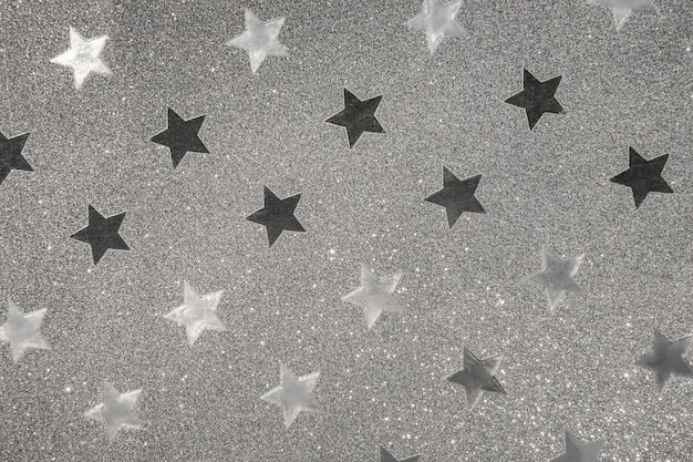 Silver wrapping paper, flickering star shape as background or texture