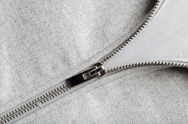 Silver zip on woolen fabric copy space