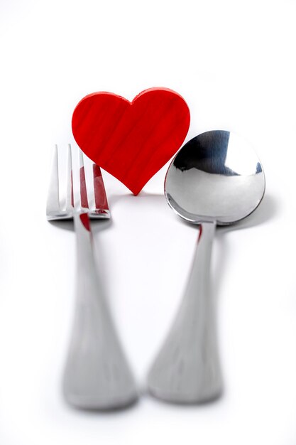 Silverware of fork and spoon with a red heart