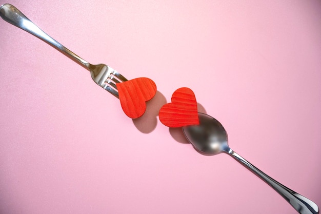 Silverware of fork and spoon with a red heart