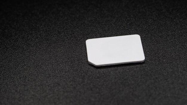 sim card for mobile phone on black