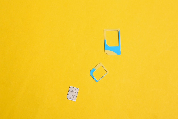 Sim cards on yellow background