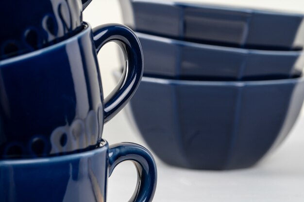 Simple ceramic blue crockery on kitchen counter. Tableware