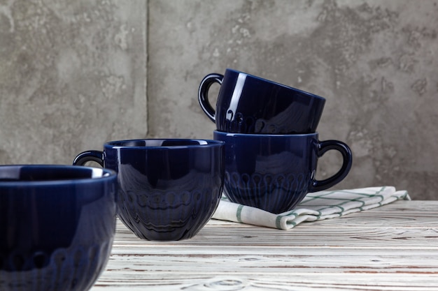 Simple ceramic blue crockery on kitchen counter. Tableware