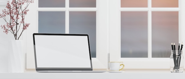 Simple home working space with laptop blank screen mockup empty space for product display