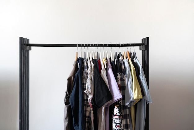 A simple minimalistic clothes rack with some textile on the hangers