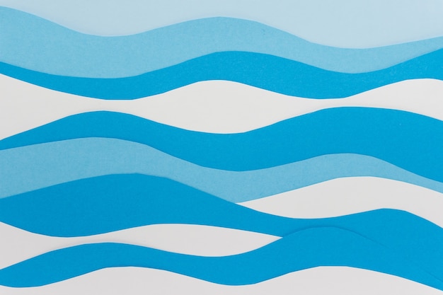 Simple paper background with wavy blue and white paper layers.