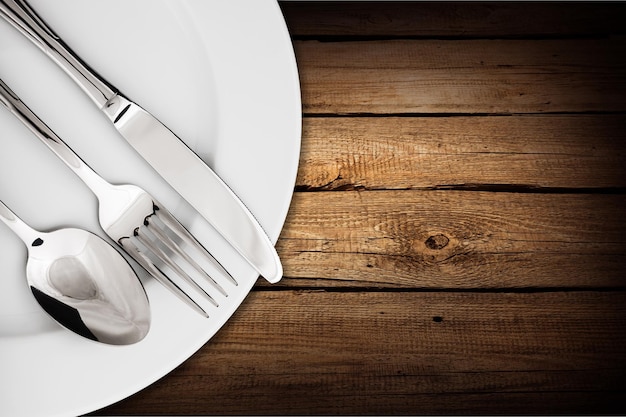 Simple table setting on wooden background