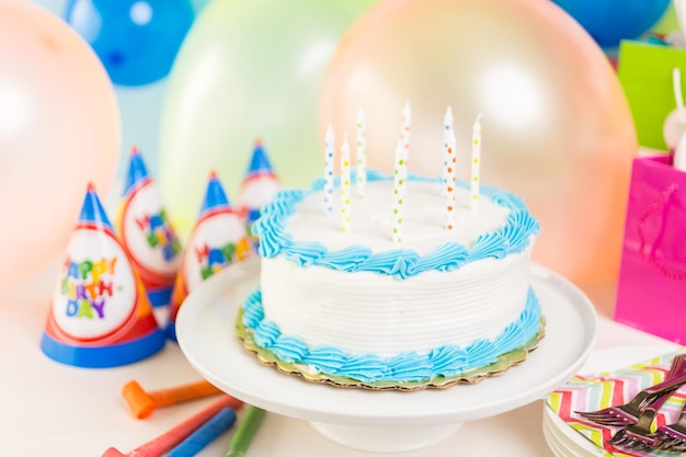 Simple white Birthday cake with cake candles.