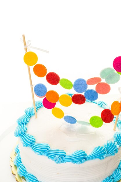 Simple white Birthday cake with cake garland.