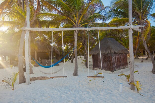 Simple wooden swing in a nice hotel on an exotic beach