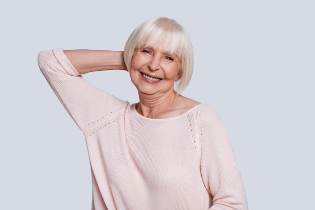 Simply happy. Beautiful senior woman looking at camera and smiling 