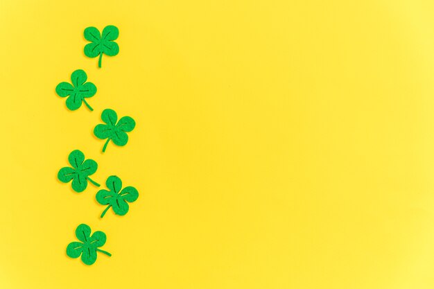 Simply minimal design with green shamrock on yellow background