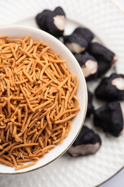 Singada or singhara garlic sev, Namkeen shev a vrat food made using water chestnut served in a bowl