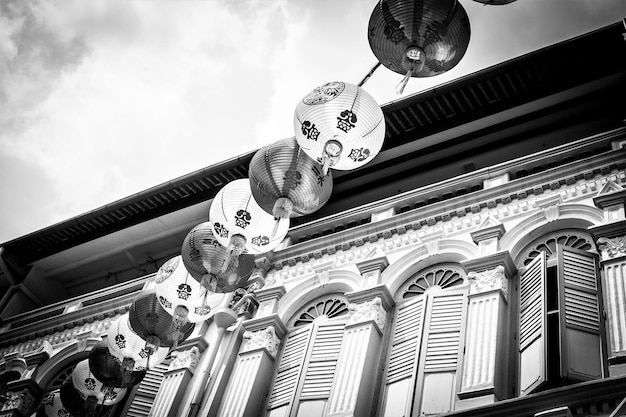 Singapore china town. chinese lanterns in front of the house\
facade