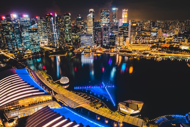 Singapore city skyline with modern skyscraper architecture building for concept of financial business and travel in Asia cityscape urban landmark marina bay at night district dusk sky