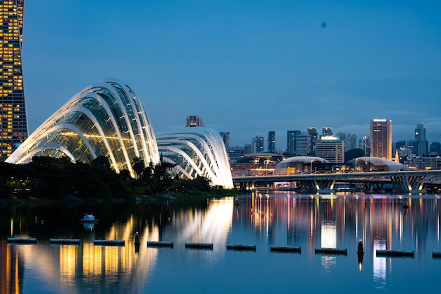 Singapore city skyline with modern skyscraper architecture building for concept of financial business and travel in Asia cityscape urban landmark marina bay at night district dusk sky