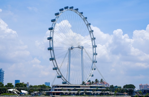 Singapore flyer, ferris wheel in sunny day, tourist attraction